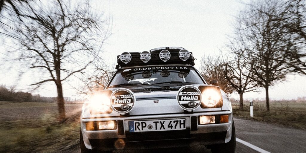 Truck with HELLA X-Treme Series LED Driving Lights in white mode, IP69K, rooftop auxiliary high-beam for off-road.