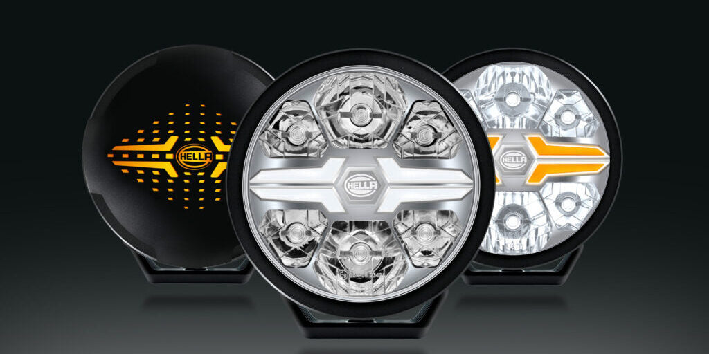 HELLA X-Treme Series LED Driving Lights in rugged aluminum housing with white and amber X-shape position light, IP69K-rated, auxiliary high-beam for off-road