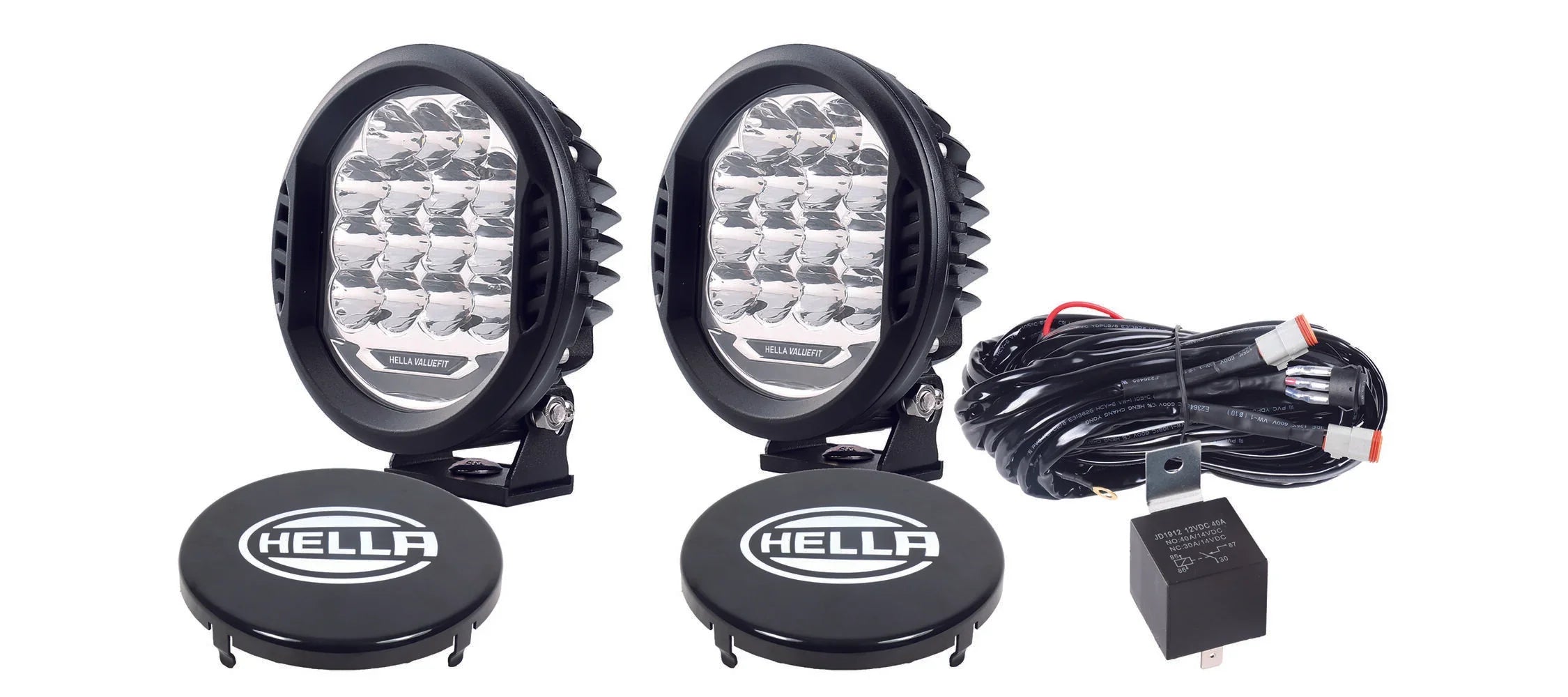 HELLA X-Treme Series LED Driving Lights in white mode with rugged IP69K aluminum housing, auxiliary high-beam, X-shape position light, off-road ready.