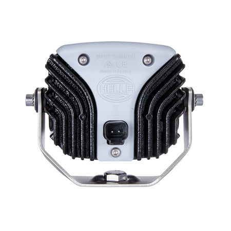 Rear view of a gray and black Hella Power Beam 1500 LED work lamp with cooling fins and mounting bracket.