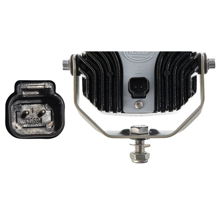 Power Beam 1500 LED work lamp, black aluminum housing with cooling fins, silver mounting bracket, and power connector.