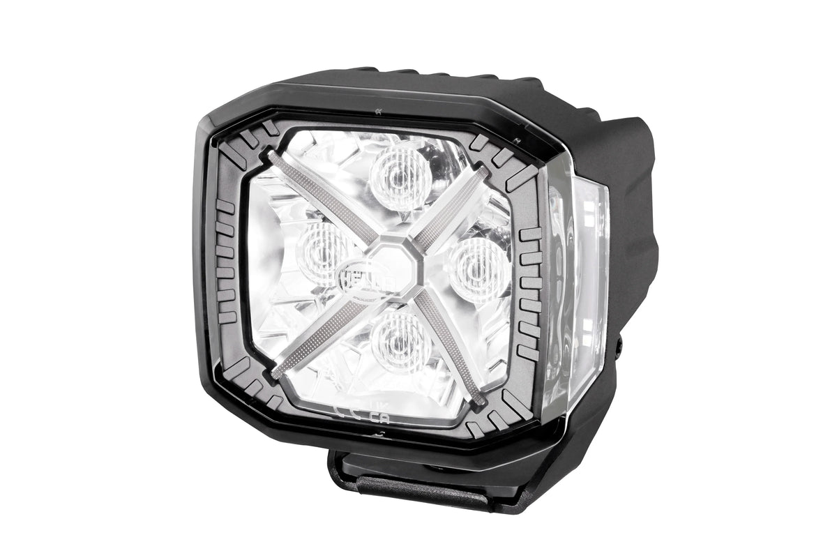 HELLA X-Treme Series LED Driving Light in white mode with X-shape position light, IP69K, rugged aluminum, auxiliary high-beam, off-road