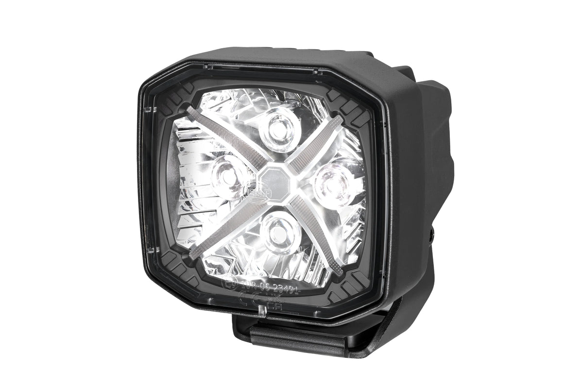 HELLA X-Treme Series LED Driving Lights in white mode with X-shape position light, IP69K, rugged housing, auxiliary high-beam for off-road