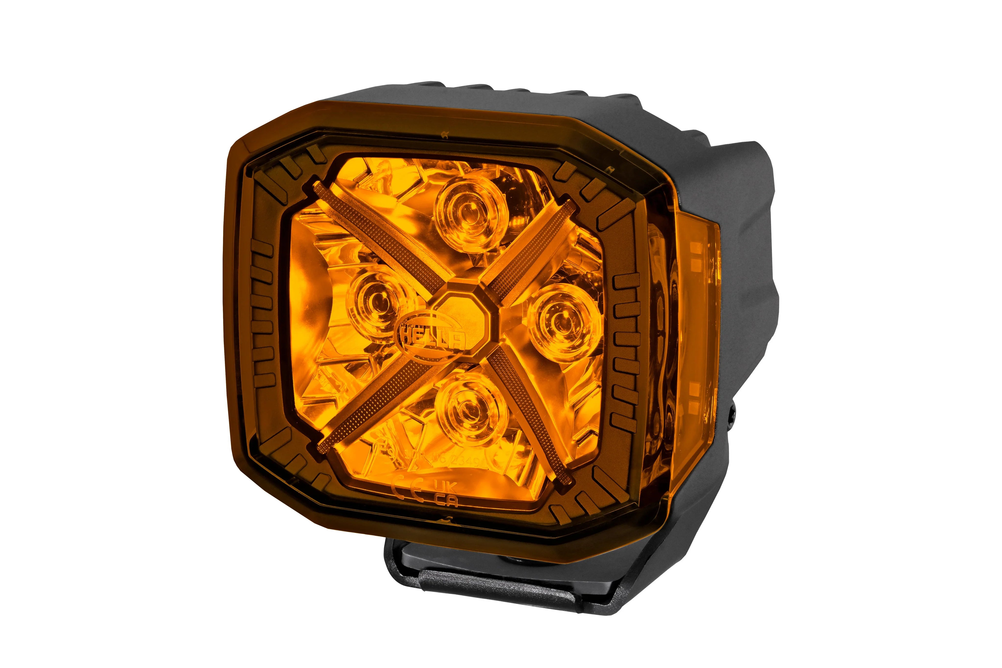 HELLA X-Treme Series LED Driving Lights in Amber mode with X-shape position light, IP69K, rugged aluminum housing, auxiliary high-beam, off-road ready.