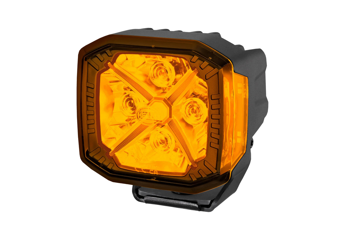 HELLA X-Treme Series LED Driving Lights in amber mode, X-shape position light, rugged aluminum, IP69K, auxiliary high-beam, for off-road