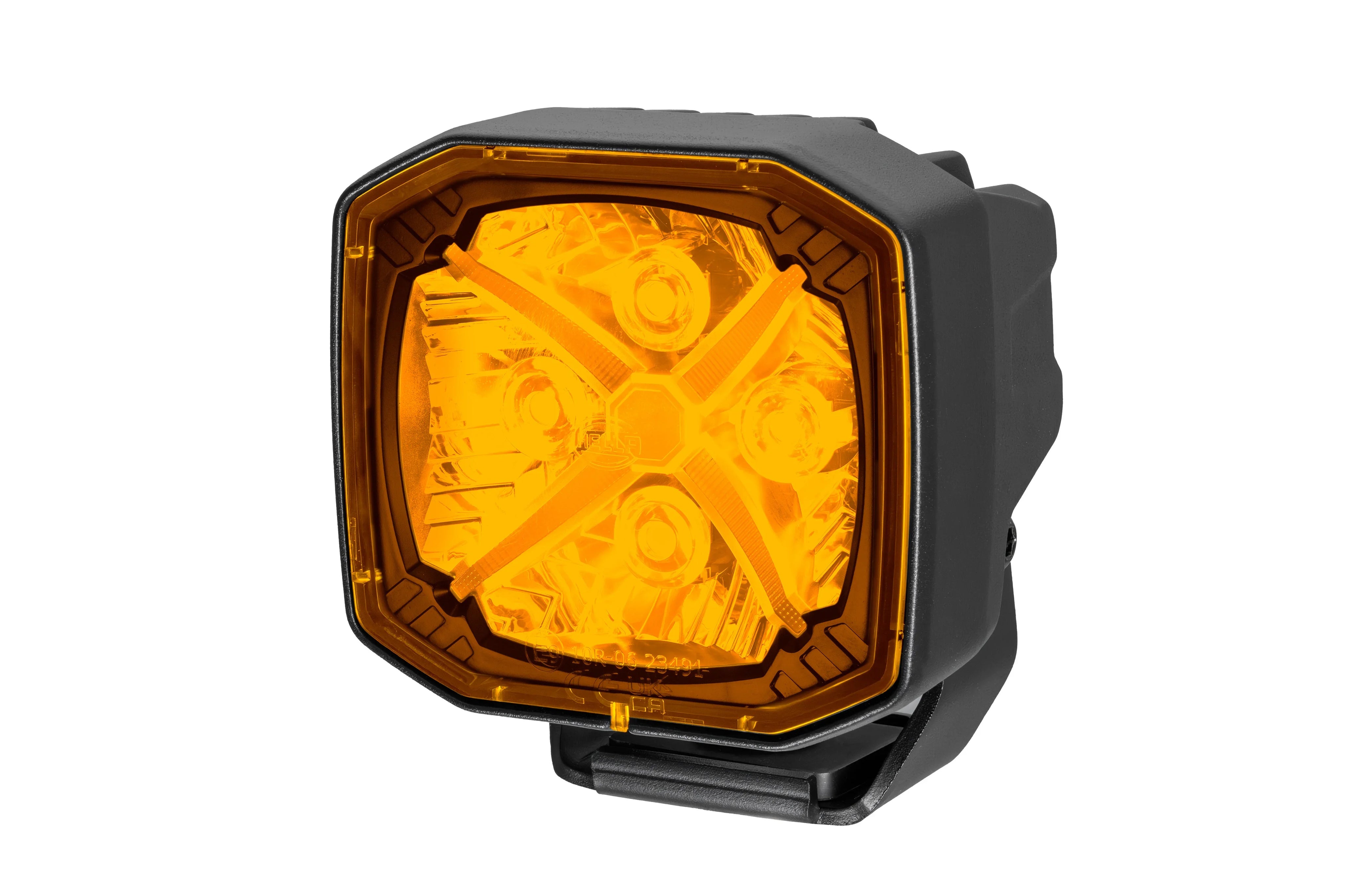 HELLA X-Treme Series LED Driving Lights in amber mode with X-shape position light, IP69K rugged housing, auxiliary high-beam, off-road