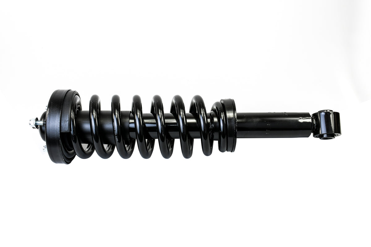 Black Hella 2" leveling strut for Ford F150 2009-2013, with coil spring and shock absorber.