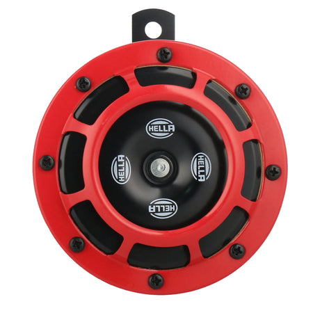 HELLA X-Treme Series auxiliary high-beam LED driving light with IP69K rating, rugged red housing, and X-shape position light for off-road use.