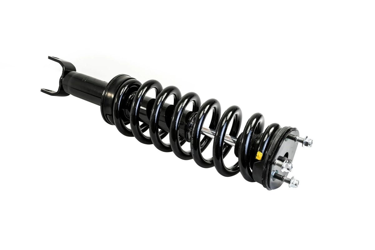 HELLA Performance 2" Leveling Strut for RAM 1500 (2009-2018) — diagonal-right view of black coilover shock with heavy-duty coil spring
