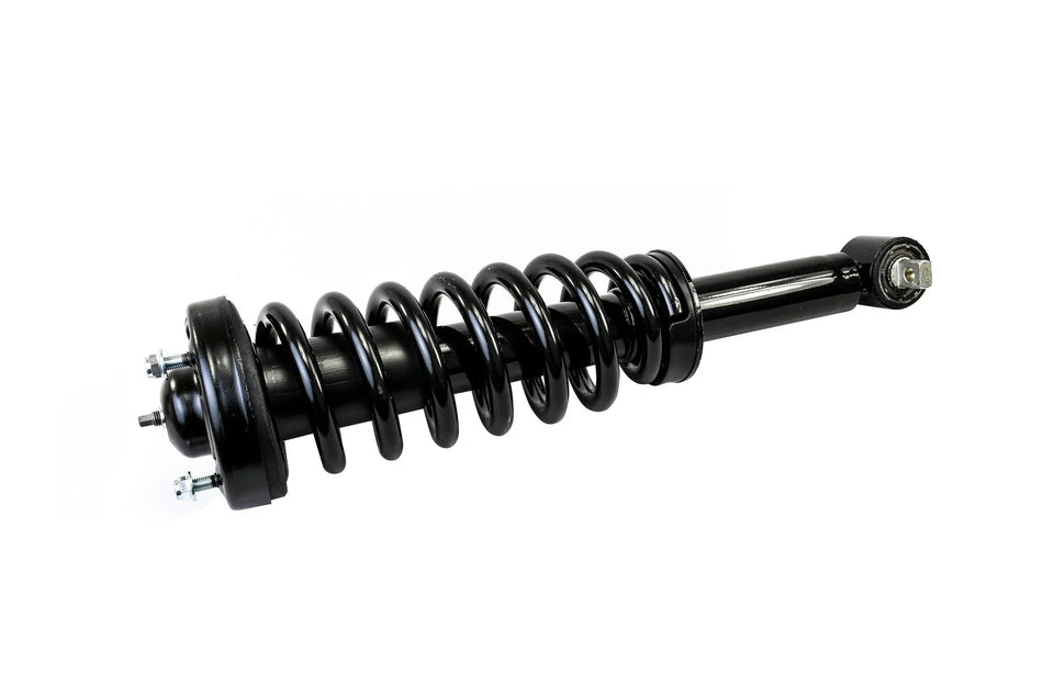 No HELLA X-Treme Series LED Driving Light present, only a black automotive coilover shock absorber.