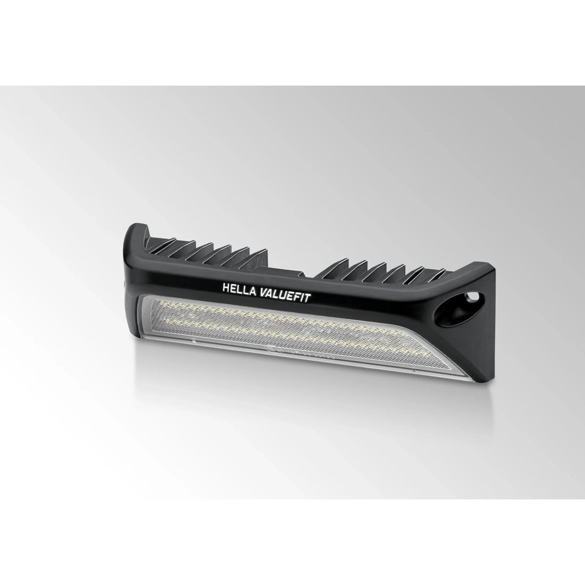 HELLA X-Treme Series LED Driving Lights in white mode with X-shape position light, IP69K rated, rugged aluminum housing, auxiliary high-beam for off-road use.