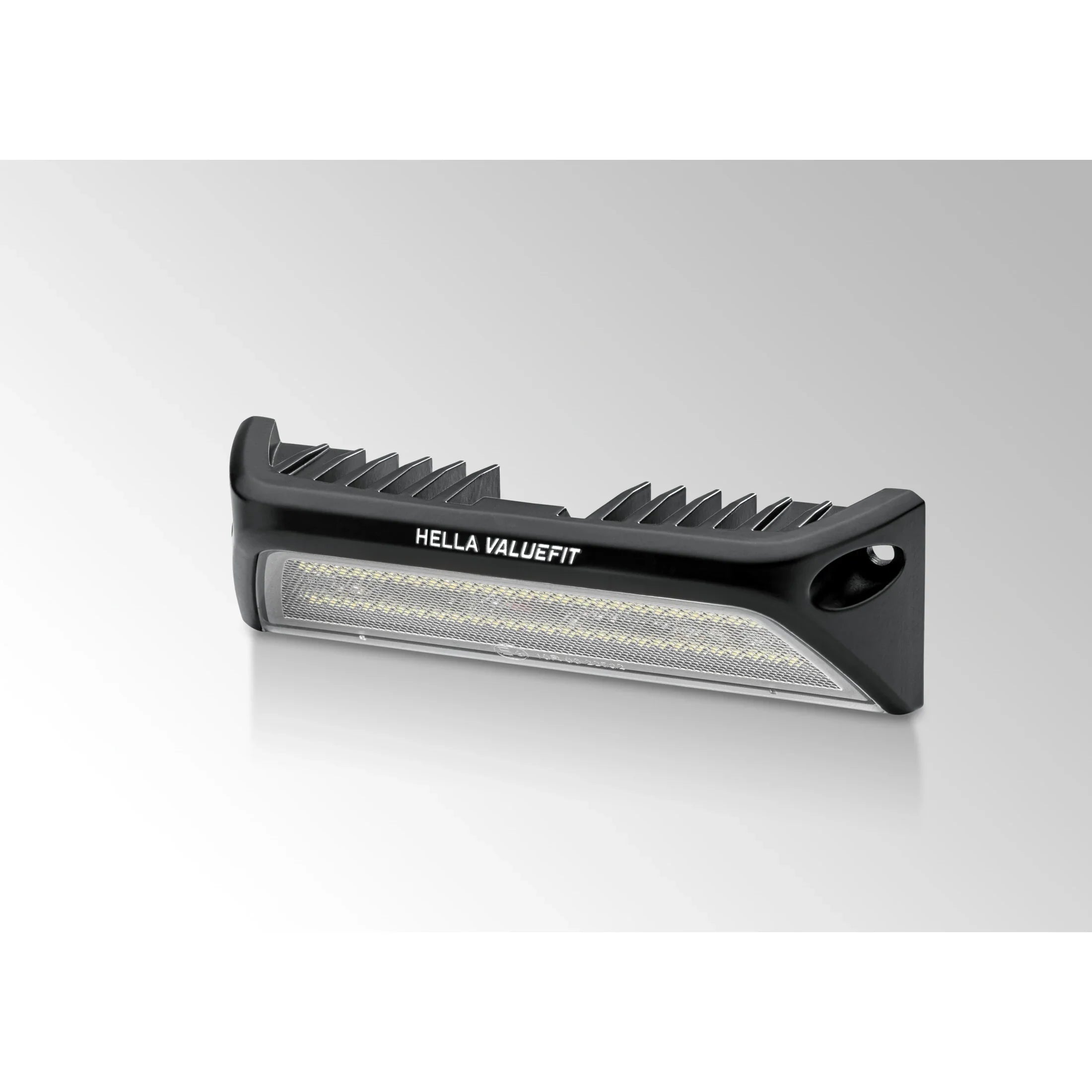 HELLA X-Treme Series LED Driving Lights in white mode with X-shape position light, IP69K rated, rugged aluminum housing, auxiliary high-beam for off-road use.