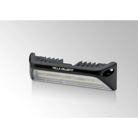 HELLA X-Treme Series LED Driving Lights in white mode with X-shape position light, IP69K rated, rugged aluminum housing, auxiliary high-beam for off-road use.