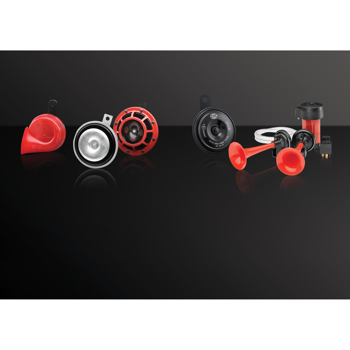 Red and black HELLA twin-tone electric trumpet horns and disc horns with relay.