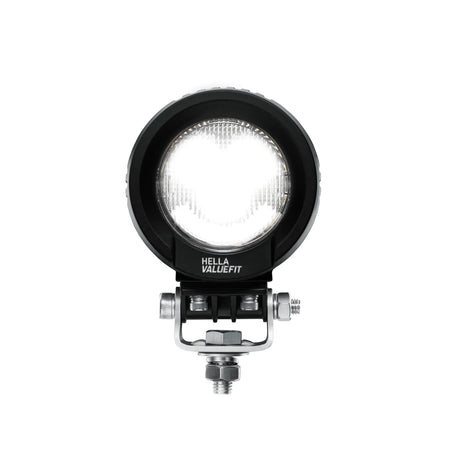HELLA X-Treme Series LED Driving Lights in white mode, IP69K, with X-shape position light, rugged aluminum housing, clear lens, auxiliary high-beam, off-road ready.