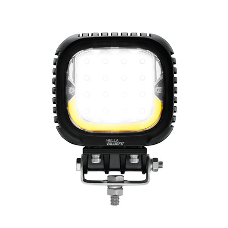 HELLA X-Treme Series LED Driving Light in amber mode, X-shape position light, rugged aluminum IP69K housing, auxiliary high-beam, off-road ready.